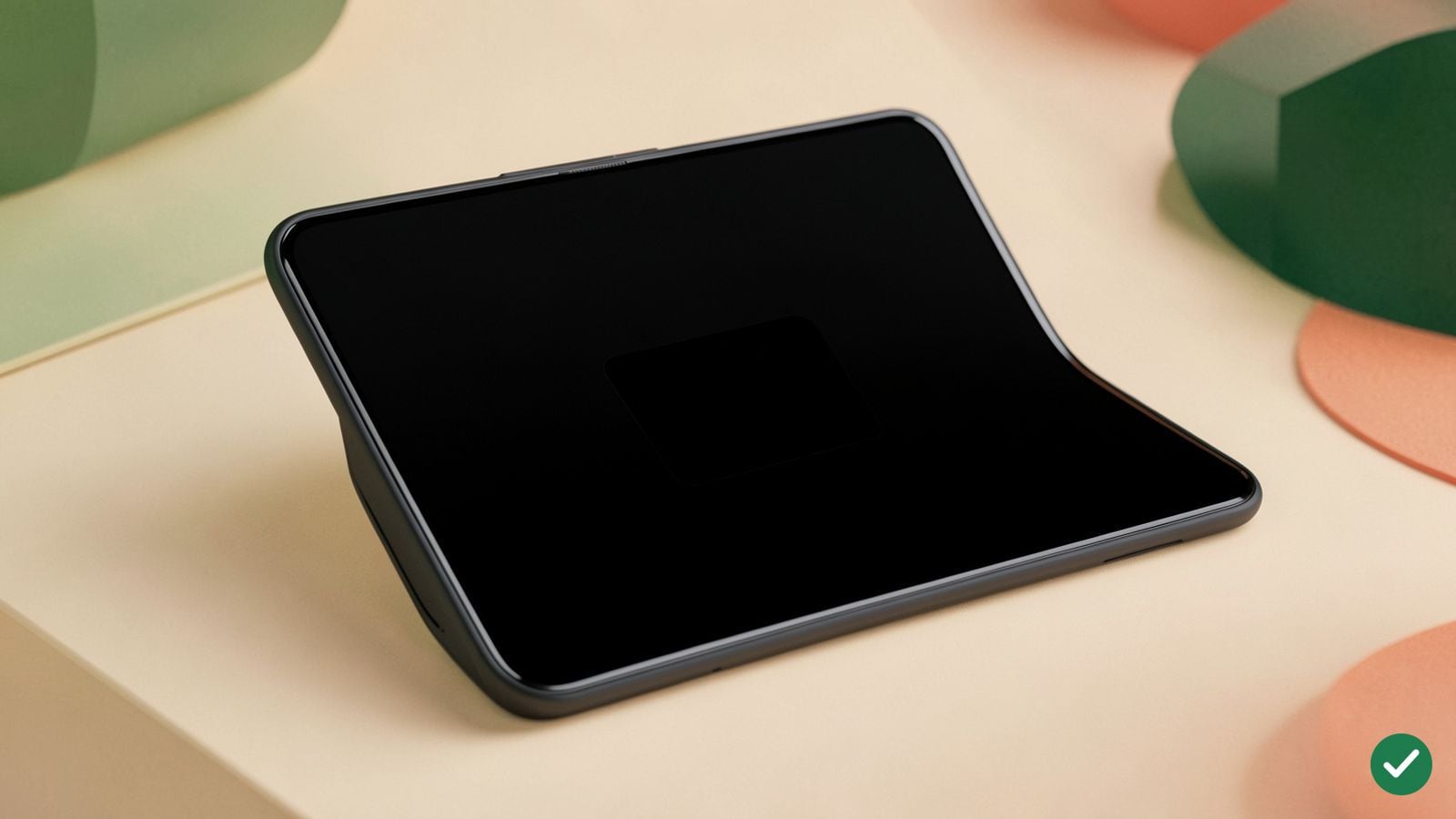 Skládací smartphone otevřený naplocho s aplikací v úzkém okně obklopeném tmavým pozadím